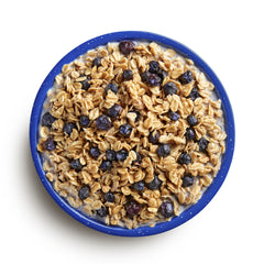bowl filled with Mountain House granola and blueberries with milk, food storage and backpacking meals